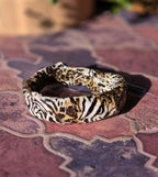 Bracciale Asimmetrico Artigianale con Motivi Animalier