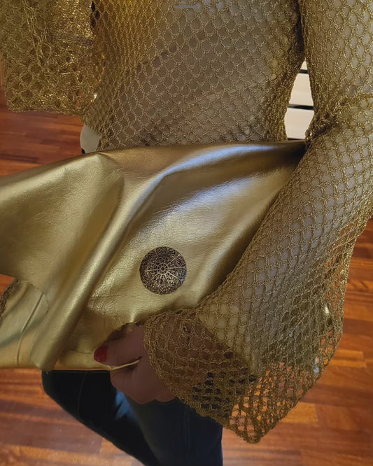 Gold colored clutch bag