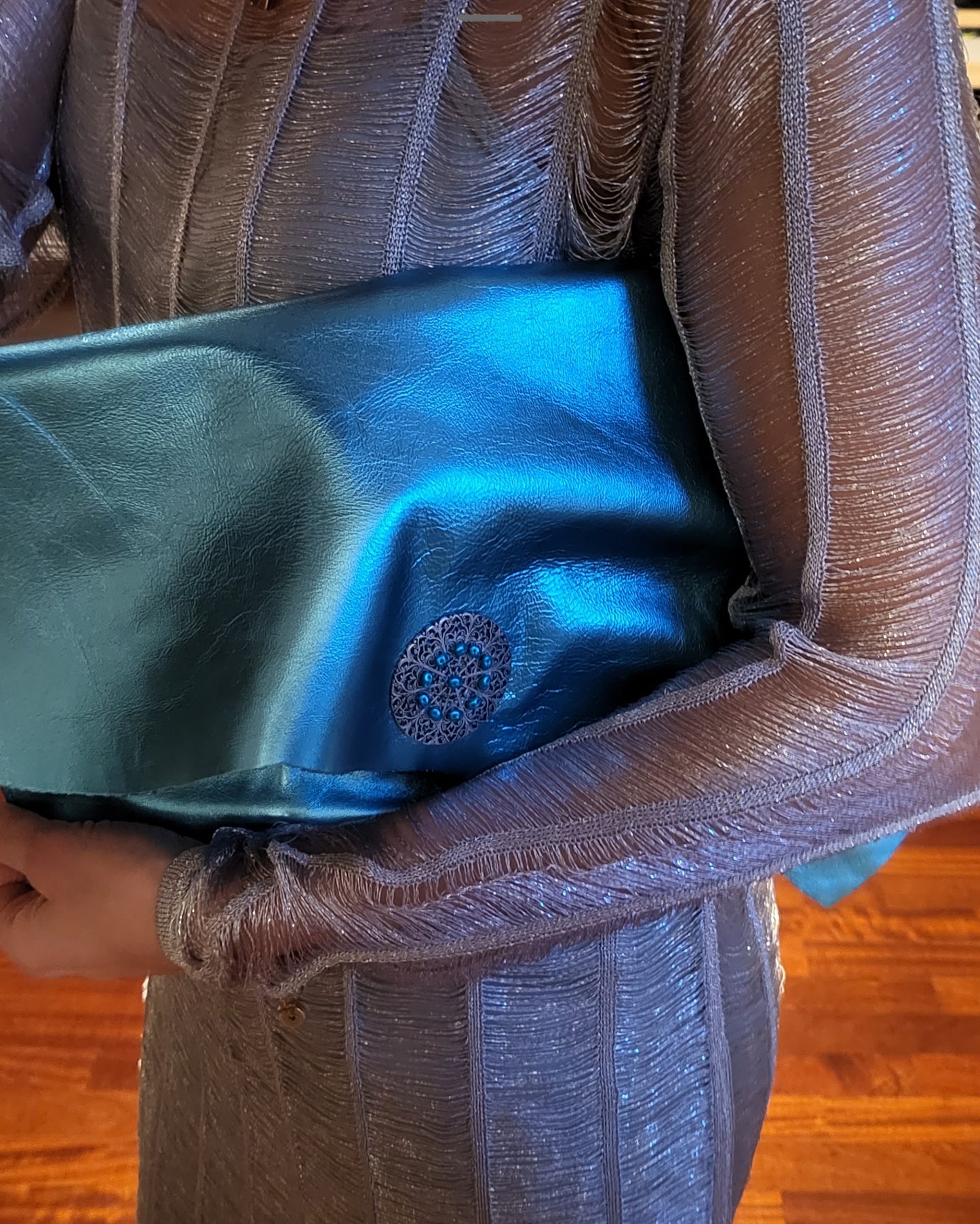 Metallic blue clutch bag